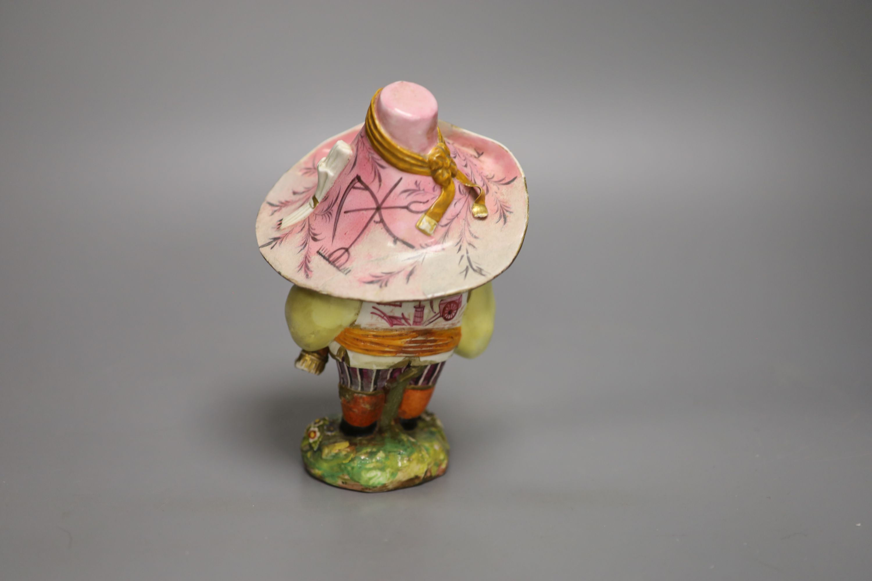 A Derby model of a Mansion Dwarf, modelled as a portly man wearing a large brimmed hat with a menu on it, c.1815 , height 18cm